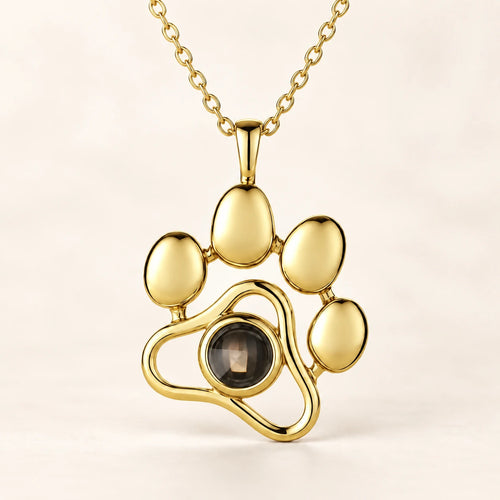 Paw pendant in gold-tone, with the photo stone at the centre