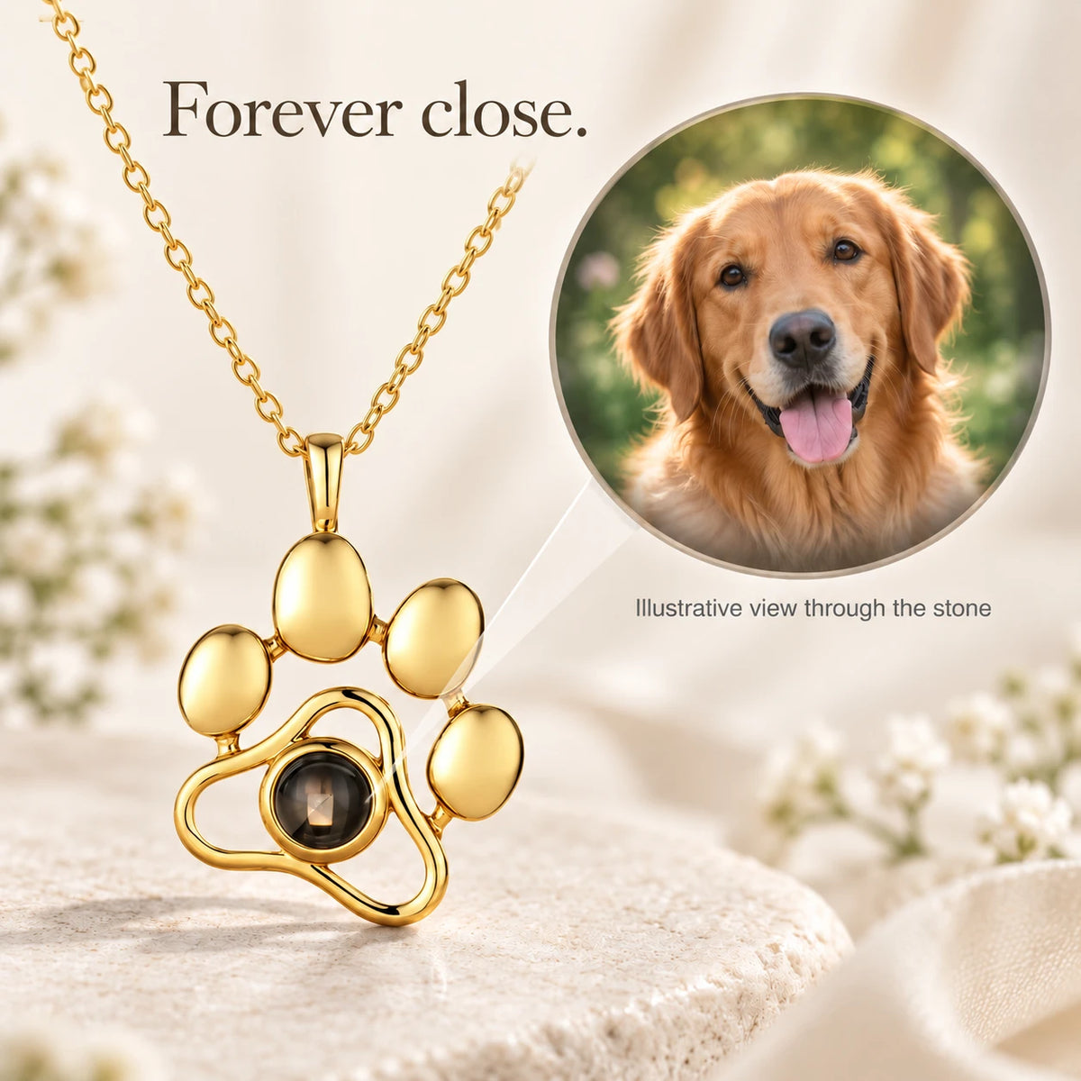 Paw pendant in gold-tone, with an illustrative view of a dog photo through the stone