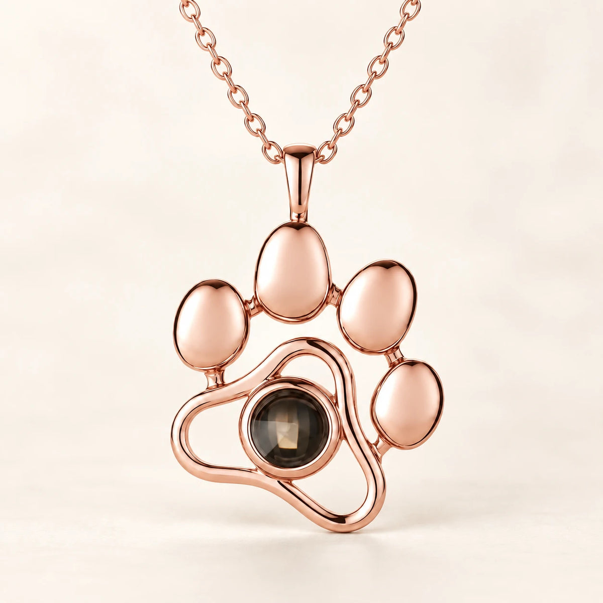 Paw pendant in rose-gold-tone, with the photo stone at the centre
