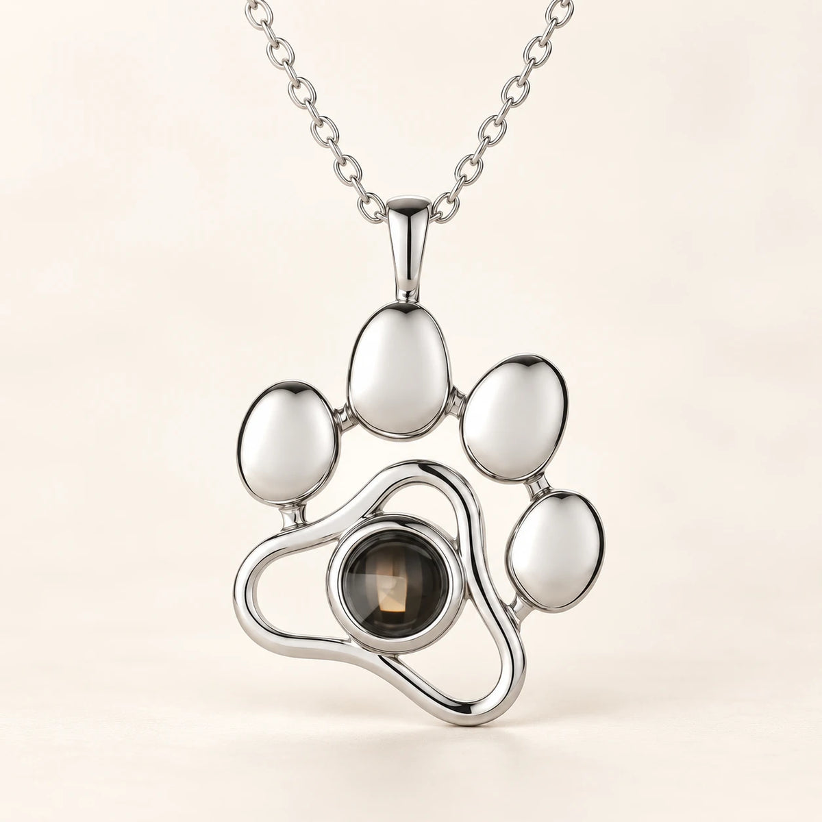 Paw pendant in silver-tone, with the photo stone at the centre